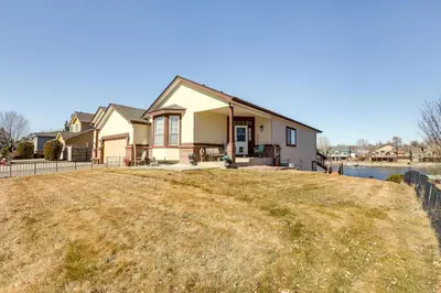 a house on a hill with a yard at 7 Mi to Dtwn Denver Lakefront Gem with Dock! in Denver