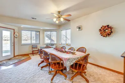 a dining room with a table and chairs at 7 Mi to Dtwn Denver Lakefront Gem with Dock! in Denver