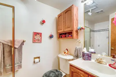 a bathroom with a toilet and a sink at 7 Mi to Dtwn Denver Lakefront Gem with Dock! in Denver