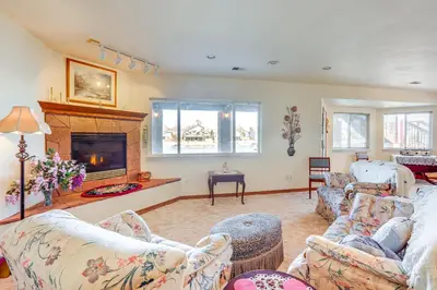 a living room with couches and a fireplace at 7 Mi to Dtwn Denver Lakefront Gem with Dock! in Denver