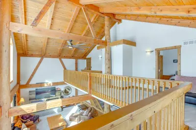 a view from the loft of a log home with wooden ceilings at 6 Mi to Winter Park Resort Spacious Family Cabin in Fraser