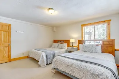 a bedroom with two beds and a window at 6 Mi to Winter Park Resort Spacious Family Cabin in Fraser