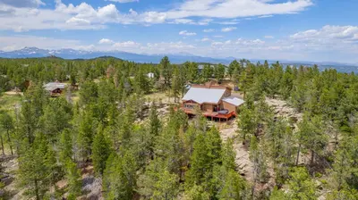 an aerial view of a house in the woods at Golden Oasis in Golden
