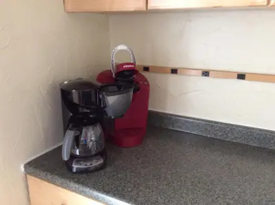 a coffee maker on a counter in a kitchen at Charming Studio Apartment in the Heart of Golden in Golden