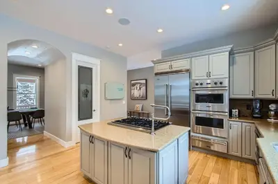 a kitchen with white cabinets and a counter top at Mountain Majesty home in Black Hawk