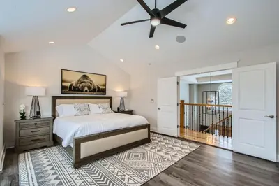 a bedroom with a bed and a ceiling fan at Mountain Majesty home in Black Hawk