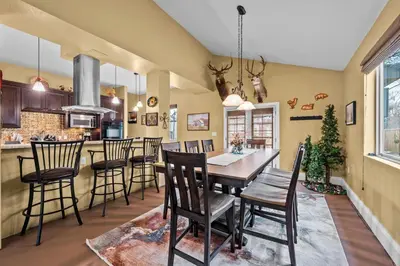 a kitchen and dining room with a table and chairs at 180 S Hoyt in Lakewood
