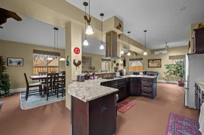 a large kitchen and dining room with a dining table at 180 S Hoyt in Lakewood
