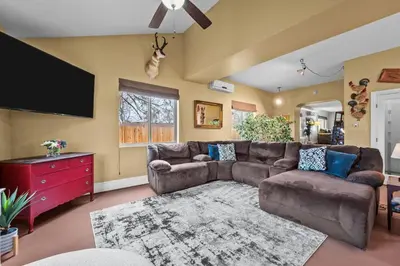 a living room with a couch and a flat screen tv at 180 S Hoyt in Lakewood