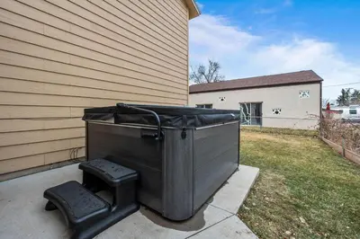 a trash can sitting next to a house at 180 S Hoyt in Lakewood