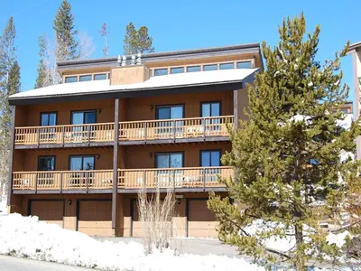an apartment building with a large balcony at Timber Run in Winter Park