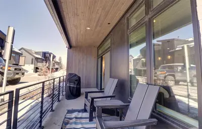 two chairs on the porch of a house at River West 515 condo in Silverthorne