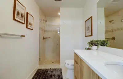 a bathroom with a shower and a toilet and a sink at River West 515 condo in Silverthorne