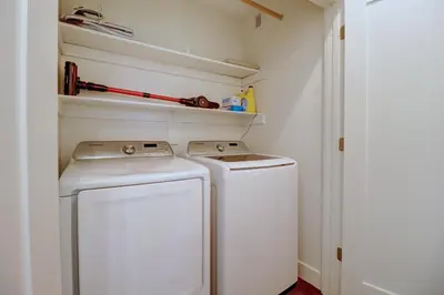 a small laundry room with a washer and dryer at River West 515 condo in Silverthorne