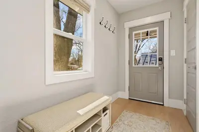 a hallway with a bench and a window at CSU Hideaway with King Bed, Backyard Oasis in Fort Collins