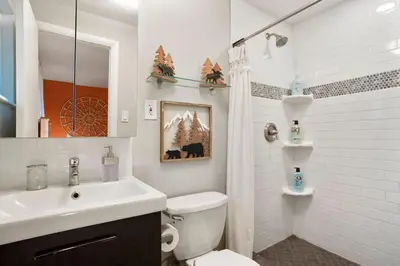 a white bathroom with a sink and a toilet at BRAND NEW Classic Fire Pit 2 Kings Pet Friendly in Arvada