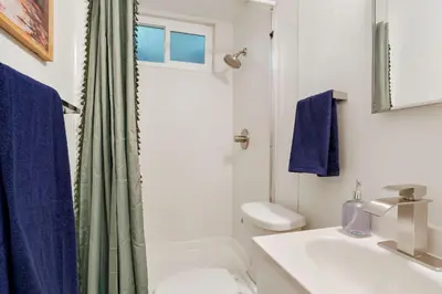 a bathroom with a sink and a toilet and a shower at BRAND NEW Classic Fire Pit 2 Kings Pet Friendly in Arvada