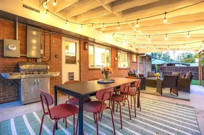 a kitchen and dining room with a table and chairs at BRAND NEW Classic Fire Pit 2 Kings Pet Friendly in Arvada
