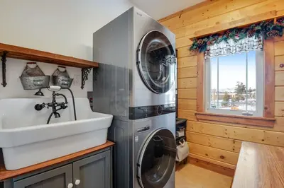 a kitchen with two washing machines and a sink at Granby Modern Cabin - Hot Tub & Mountain Views in Granby