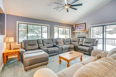 a living room with a couch and a table at Home with Mtn Views in Frisco Near 3 Ski Resorts! in Frisco
