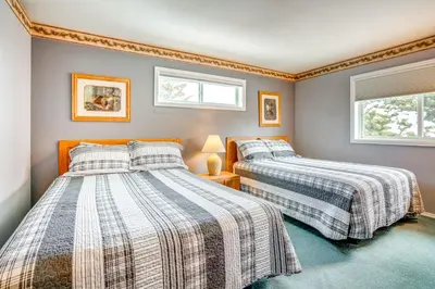 two beds in a room with two windows at Home with Mtn Views in Frisco Near 3 Ski Resorts! in Frisco