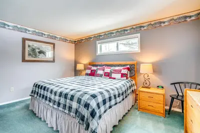 a bedroom with a bed and a table and a chair at Home with Mtn Views in Frisco Near 3 Ski Resorts! in Frisco