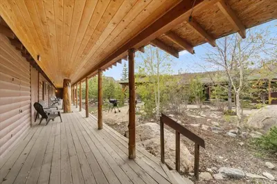 a porch of a house with a wooden deck at Black Bear Studio in Tranquil Courtyard by Grand Luxe in Grand Lake