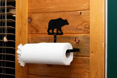 a roll of toilet paper with a black cat on a wall at Grand Lake Haven in town, Osprey Studio Cabin in Grand Lake