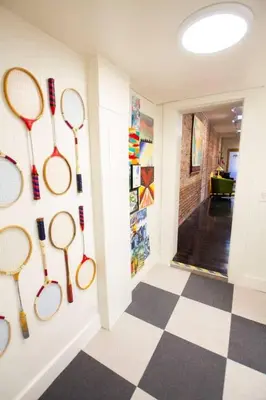 a room with tennis rackets hanging on the wall at Unique denver loft in rino art district in Denver