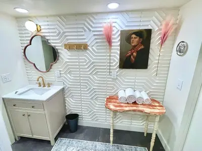 a bathroom with a sink and a mirror at Unique denver loft in rino art district in Denver