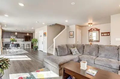a living room with a couch and a table at Beautiful Home with Bonus Room and Prime Location! in Brighton