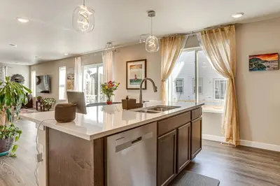 a kitchen with a sink and a large window at Beautiful Home with Bonus Room and Prime Location! in Brighton