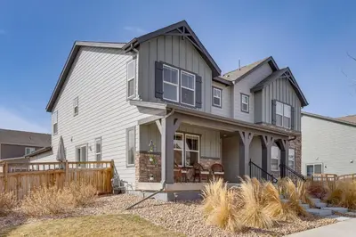 a large house with a gray at Beautiful Home with Bonus Room and Prime Location! in Brighton