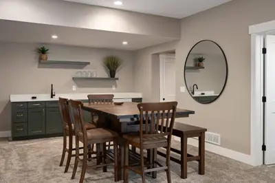 a kitchen with a table and chairs and a mirror at Lone Eagle 855 in Granby
