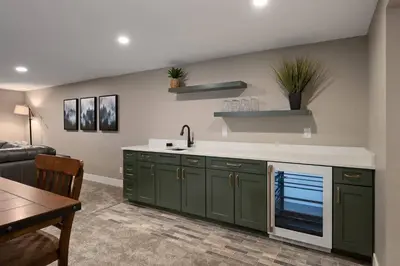 a kitchen with green cabinets and a sink at Lone Eagle 855 in Granby