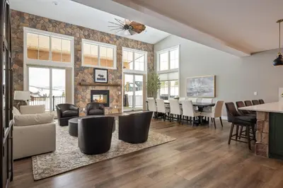 a living room with a fireplace and a dining room at Lone Eagle 855 in Granby