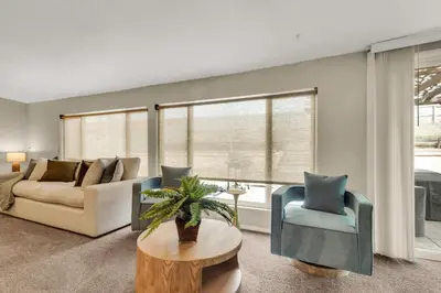a living room with a couch and a table at Chic Family Retreat with Game Room backyard with fire pit and minutes to Downtown! in Arvada