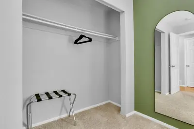 a dressing room with a mirror and a shelf at Chic Family Retreat with Game Room backyard with fire pit and minutes to Downtown! in Arvada