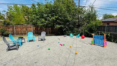 a playground with chairs and balls in the sand at Gorgeous 2-King-Bed Lower Unit in Denver in Denver