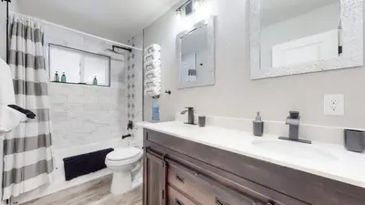 a white bathroom with a sink and a toilet at Two bedroom family home near Anschutz Medical in Aurora