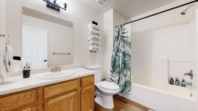 a bathroom with a sink and a toilet and a shower at Convenient two bedroom near DIA in Brighton