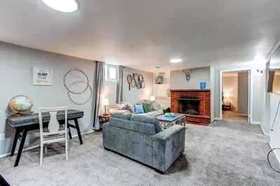 a living room with a couch and a table at Spacious family home in Littleton with fenced yard in Littleton