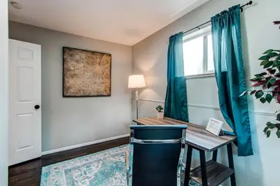 a home office with a desk and a window at Spacious family home in Littleton with fenced yard in Littleton