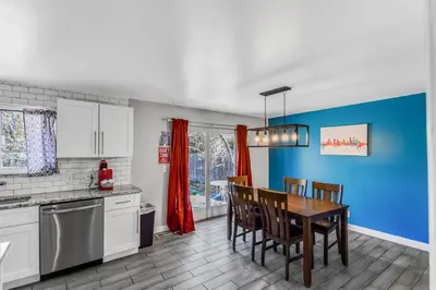 a kitchen with a table and chairs in a kitchen at Huge family home in Centennial with five bedrooms large yard and plenty of parking in Centennial