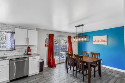 a kitchen with a table and chairs in a room at Huge family home in Centennial with five bedrooms large yard and plenty of parking in Centennial