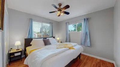 a bedroom with a bed and a ceiling fan at Great two bedroom family spot with convenient access to downtown in Denver