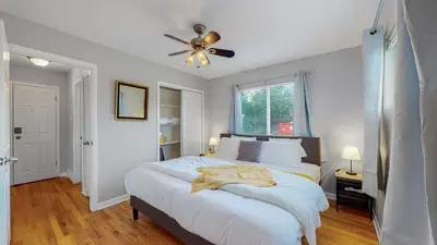 a bedroom with a bed and a ceiling fan at Great two bedroom family spot with convenient access to downtown in Denver