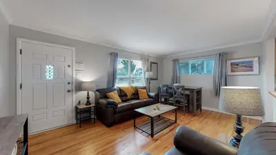 a living room with a couch and a table at Great two bedroom family spot with convenient access to downtown in Denver