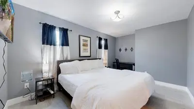 a bedroom with a large white bed in a room at Spooky Victorian Family house with four bedrooms central to downtown in Denver