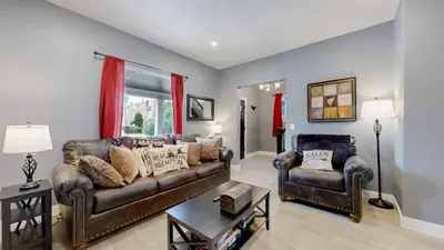 a living room with a couch and two chairs at Spooky Victorian Family house with four bedrooms central to downtown in Denver